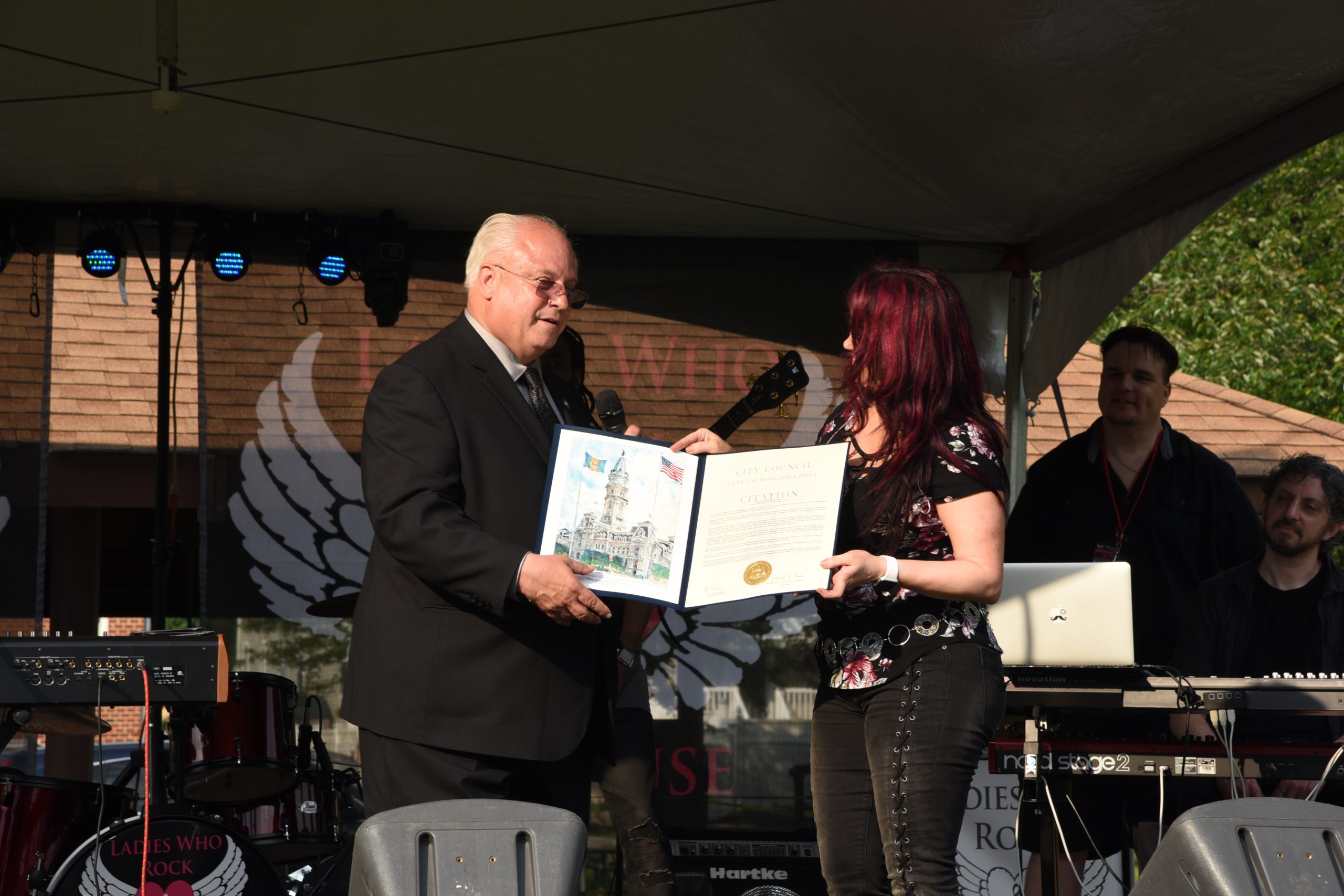 Sharon Lia Pres & CEO being presented with a commendation for the work of LWRFAC, from Philadelphia city councilman-at-large Al Taubenberger at 2018 Festival.